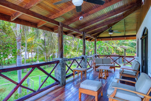 Large wooden deck with a peaceful view of the palms.