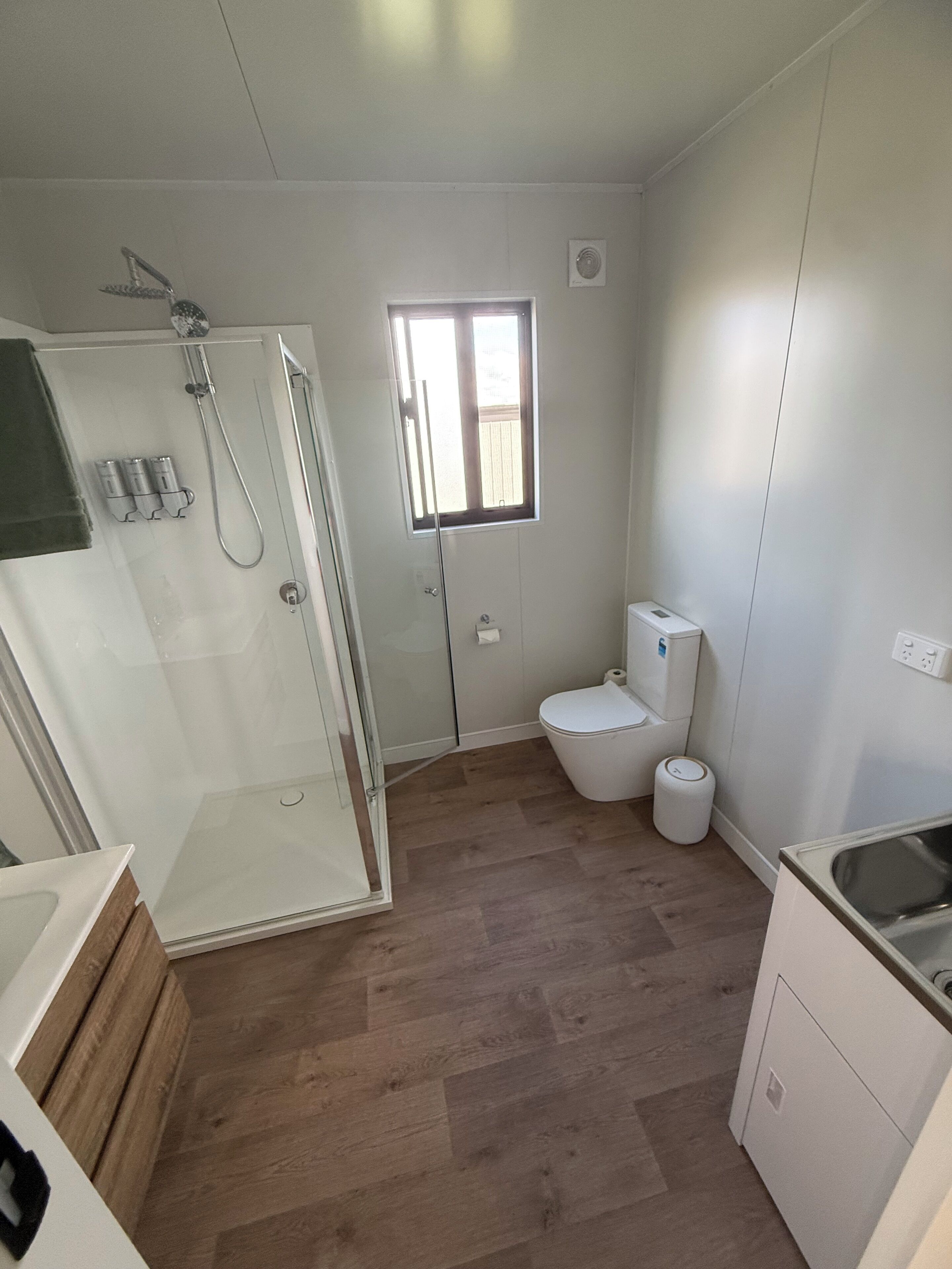 Shower, towels, soap, toilet paper