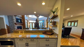 A kitchen with granite countertops, stainless steel appliances, and a large island. - CR1 Bretton Woods (Bretton Woods)