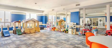 A children's play area with play structures and toys.
