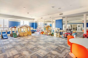 A children's play area with play structures and toys.