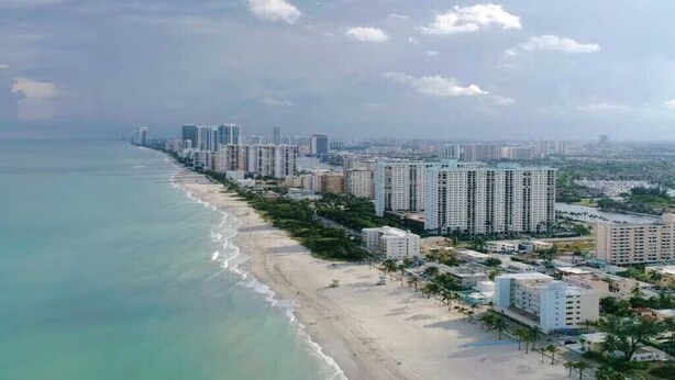 A coastal cityscape with high-rise buildings, a beach, and a clear sky. - Cozy Studio condo with AC in amazing Hollywood (Hollywood)
