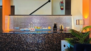 A modern bar area with a glass counter, a fire extinguisher, and a plant. - DAY & NIGHT by THE MOMENT (Chiang Mai)