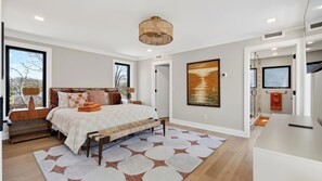 A bedroom with a bed, bedside tables, a large window, a painting, and a TV. - Sunrise in the City by Avantstay Private Plunge Pool + Outdoor Kitchen and Dining Minutes to Downtown (Nashville)