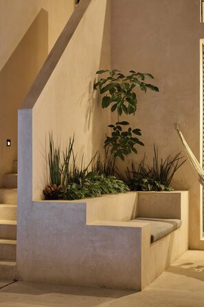 A modern staircase with built-in planters containing various plants. - 2 BR Oasis in Centro w/ Private Pool - Casa Kiik (Centro)