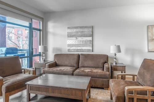 Deluxe Condo, 2 Bedrooms, Kitchen, Courtyard Area | Living area | 55-inch Smart TV with cable channels, streaming services