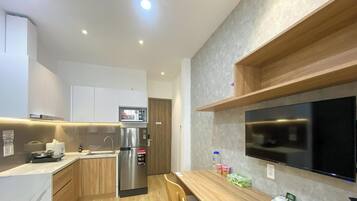 Luxury Apartment, Balcony, City View | Private kitchen | Fridge, microwave, stovetop, cookware/dishes/utensils