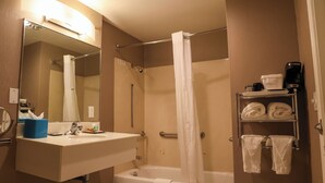 A bathroom with a sink, mirror, shower, and towel rack. - Affordable SF Centrally Located Motel Room,Free Parking,Near Moscone,Breakfast (San Francisco)