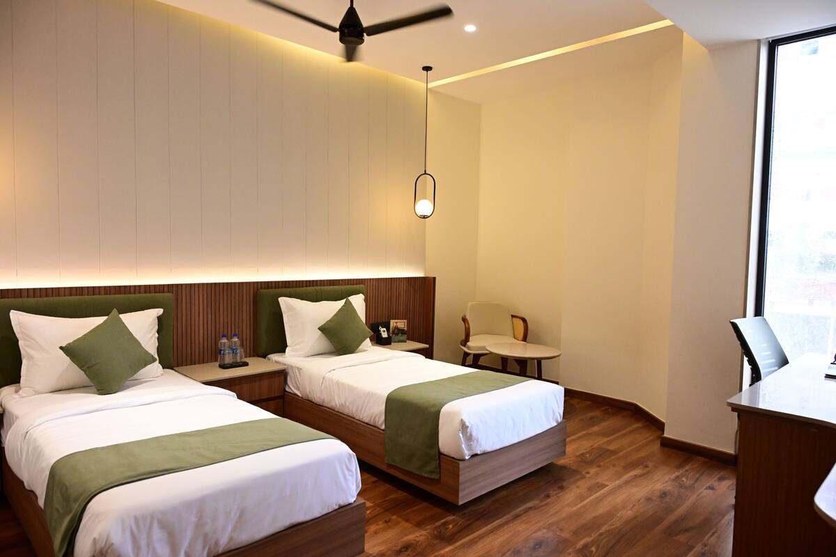 Executive Twin Room | Desk, laptop workspace, blackout drapes, iron/ironing board