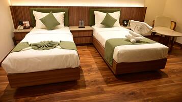 Executive Twin Room | Desk, laptop workspace, blackout drapes, iron/ironing board
