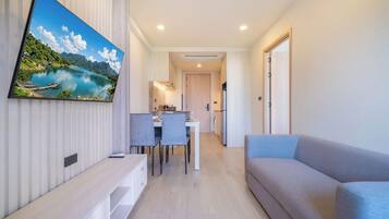 Condo, Balcony, Pool View | Living area | 55-inch flat-screen TV with digital channels