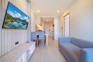 Condo, Balcony, Pool View | Living area | 55-inch flat-screen TV with digital channels - Ozone 1BR Signature Junior Suite  (Choeng Thale)
