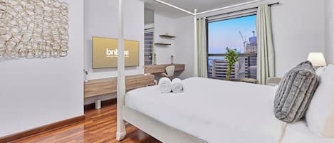 Appartement Deluxe, vue partielle sur la mer | Coffres-forts dans les chambres, rideaux occultants