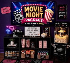 A movie night package with a large screen, popcorn, and various snacks.