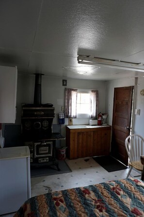 Interior - Simple Country Cabin with Ornate Wood Stove in the Colorado Mountains of Poudre Canyon (Bellvue)