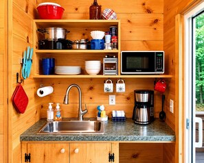 A compact kitchen with a sink, microwave, and coffee maker. - Nature Lovers Cabin with Spectacular Views of the Great Smoky Mountains, Tennesse (Cosby)