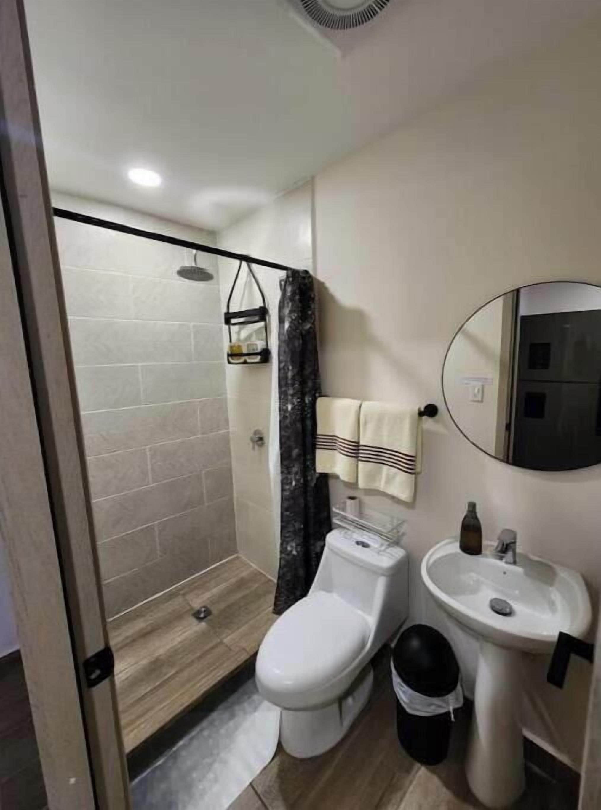 Shower, towels, soap, toilet paper
