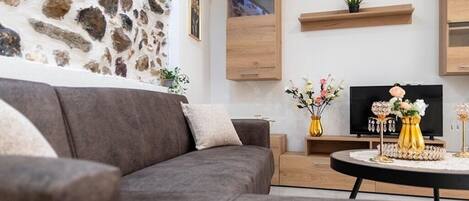 Ferienhaus, Gartenblick | Wohnbereich | Fernseher