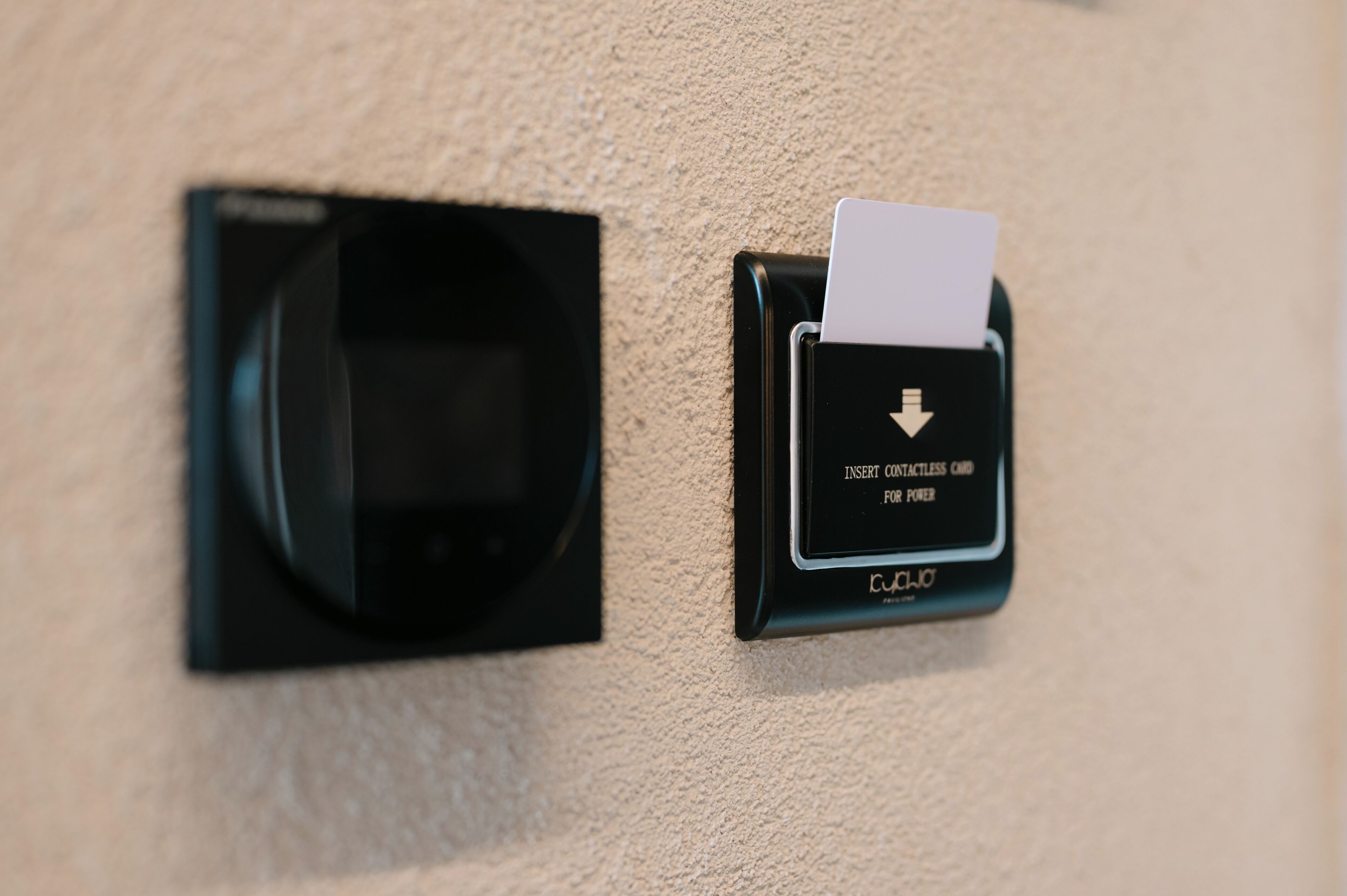 A wall-mounted mail slot with a card slot and a contactless card reader.
