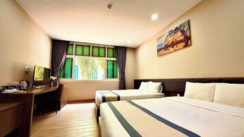 Deluxe Quadruple Room | In-room safe, desk, laptop workspace, blackout curtains