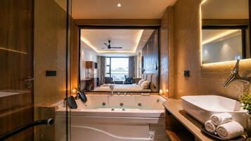 Luxury Room, City View | Bathroom | Slippers, towels, soap, shampoo