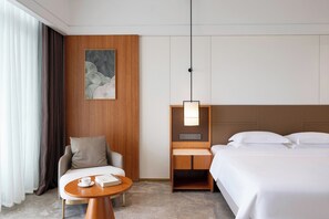 Habitación superior | Escritorio, wifi gratis y ropa de cama 