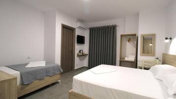 Deluxe Triple Room, Balcony, Garden View | In-room safe, desk, soundproofing, free WiFi