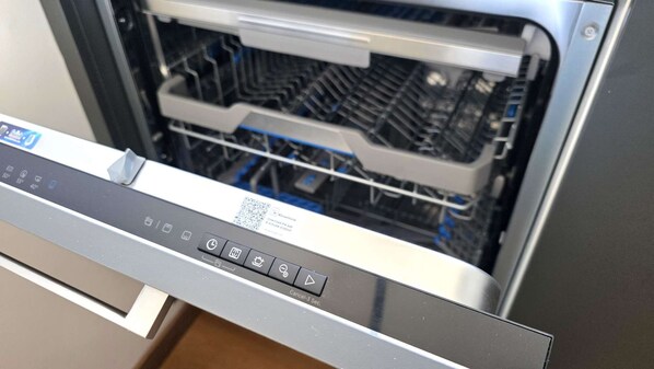 A dishwasher interior with a control panel. - Premium Comfort Living | Elegant 2BR Apartment (Larnaca)