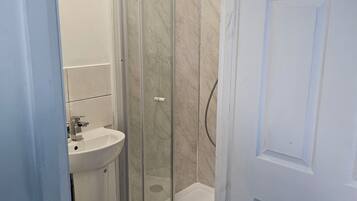 Shower, towels, toilet paper