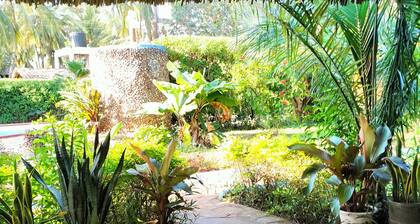 Diani beach exclusive private cottage with tropical gardens-pool-outside lounges