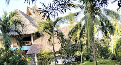 Diani beach exclusive private cottage with tropical gardens-pool-outside lounges