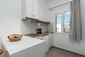 Quarto quádruplo família, vista para a cidade | Cozinha privada