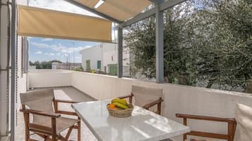 Family Quadruple Room, City View | Outdoor dining