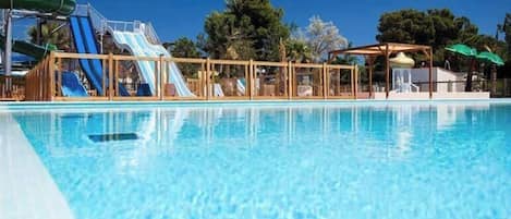 Seasonal outdoor pool, open 10:00 AM to 8:00 PM, pool umbrellas