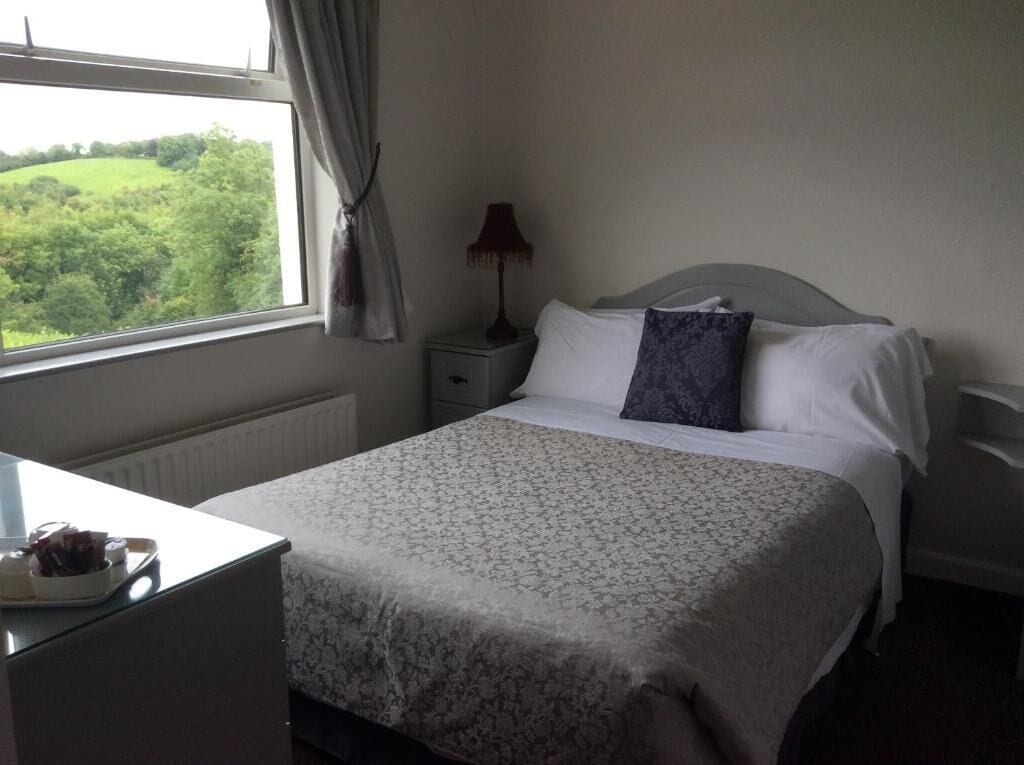 Standard Double Room, Garden View | Blackout drapes, iron/ironing board, free WiFi