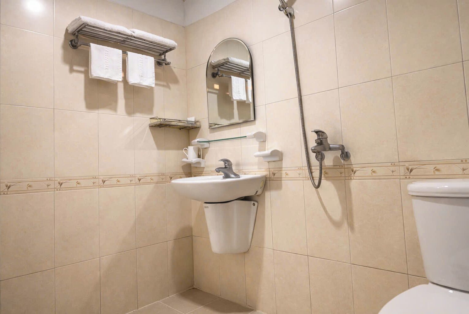 Shower, free toiletries, hair dryer, slippers