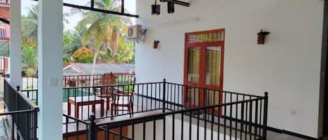Deluxe Double Room, Balcony, Garden View | Property grounds
