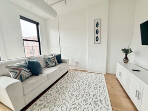 Living area - A historic 1,200 square foot loft in the heart of the Old Market with Howard Street view (Omaha)