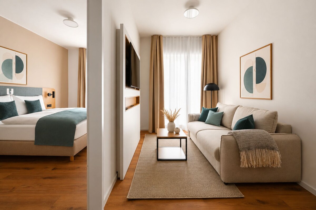 One Bedroom Suite | Living area | 50-inch flat-screen TV with cable channels