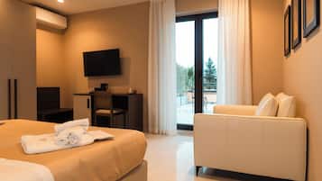 Junior Suite, Pool View | In-room safe, free WiFi