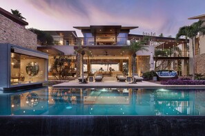 A modern house with a swimming pool, outdoor seating, and a covered patio. - Casa Herradura in Punta Mita (Punta de Mita)
