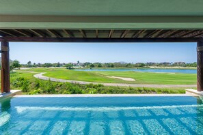 A pool with a view of a golf course and a body of water. - Condo Allegra in Punta Mita (Punta de Mita)