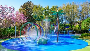 A water play area with colorful rings and a central water feature. - Bahama Bay Resort Penthouse w Lake View 15209 (Davenport)