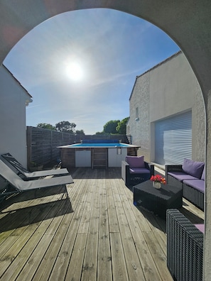 A wooden deck with a pool table, lounge chairs, and a hot tub. - Welcome to Les Renaudelles (Angles)