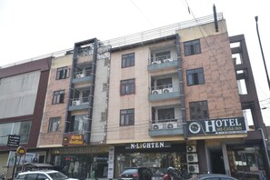 A multi-story building with a hotel named 'Hotel Me-Casa Inn' on the ground floor. - Hotel Me-Casa INN (Jaipur)