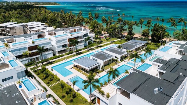 A resort with multiple swimming pools, modern architecture, and a view of the ocean. - Penthouse 4BR w/ Pool & Sea View | Sol de Arena C7 (Las Terrenas)