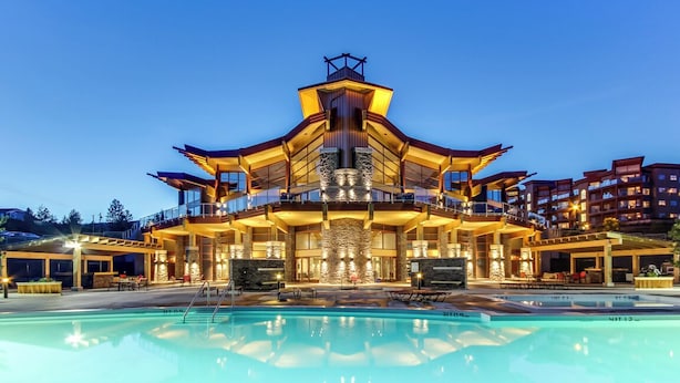 A multi-story hotel with a pool in front. - Spectacular View 1 Bdrm 202 At Amenity Filled Resort (West Kelowna)