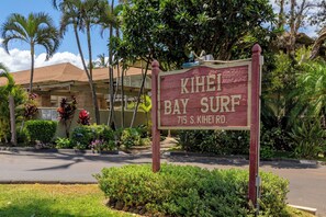 A sign for 'KIHEI BAY SURF' at 715 S. KIHEI RD. - 2nd floor, updated studio, across from the beach! - Kihei Bay Surf A207 (Kihei)