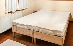 A wooden bed with a mattress and a pillow. - Awesome home in Bedsted Thy (Bedsted Thy)