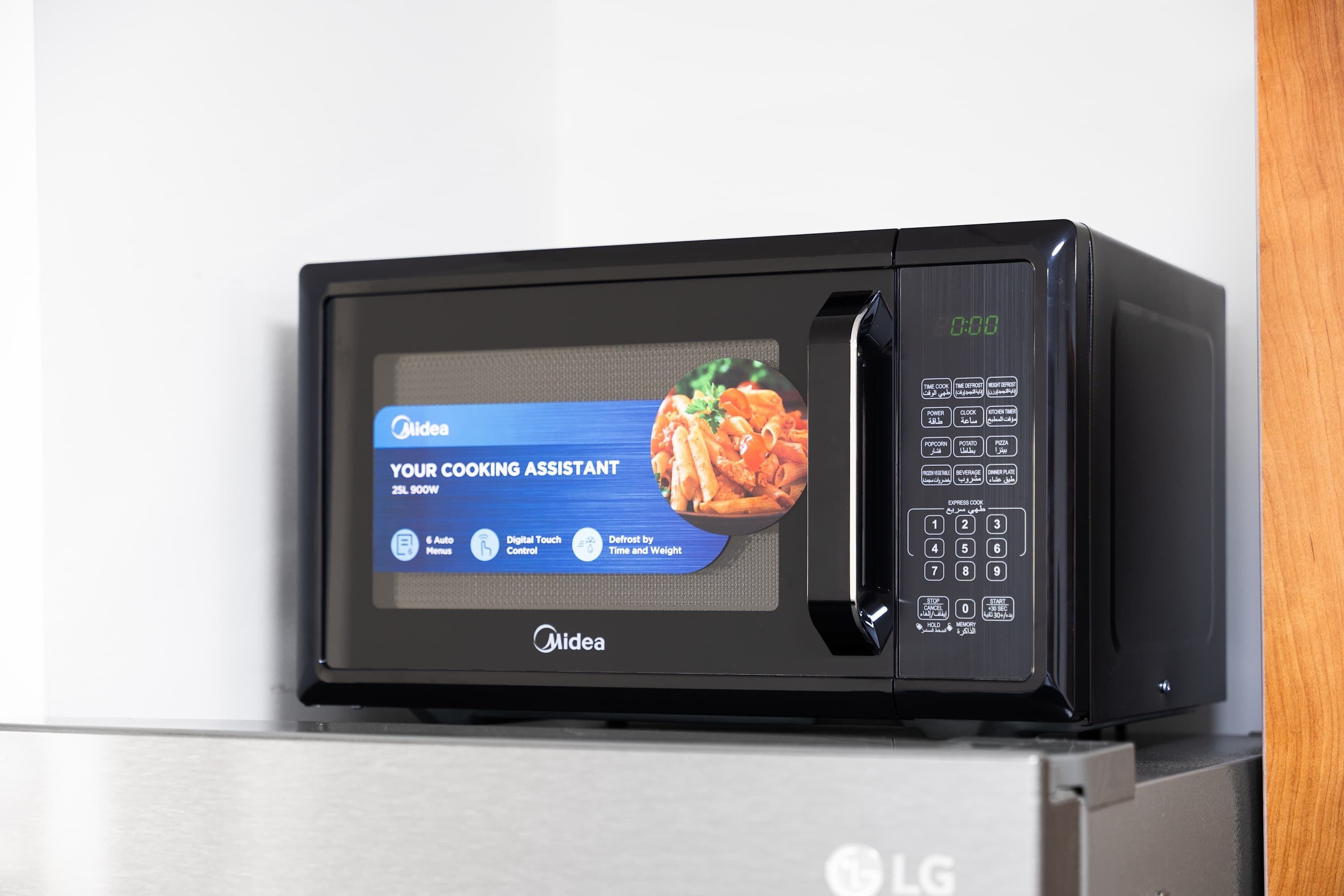 A microwave with a digital display and control panel.